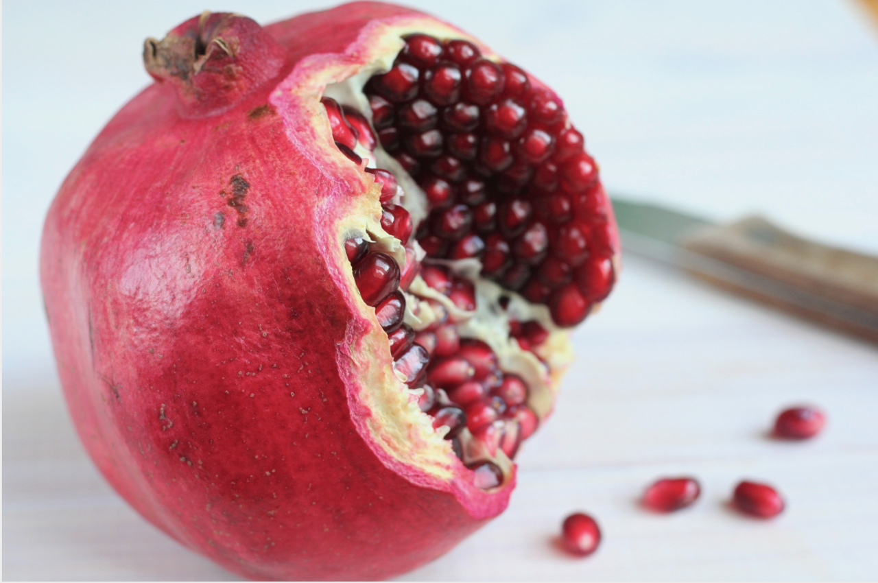 The Afterlife's Featured Image: A Pomegranate.